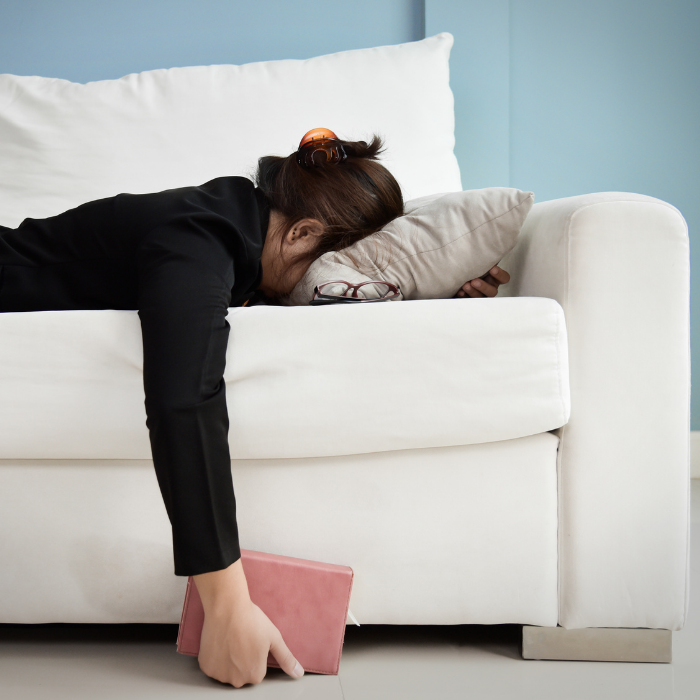 Women with head face down on pillow because she is tired