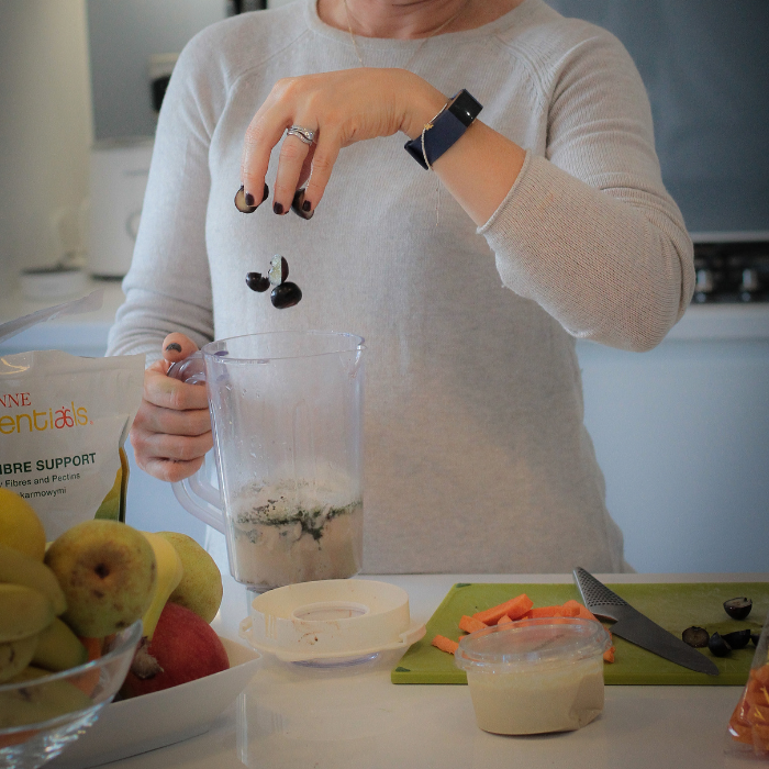 Woman making a nutritious smoothie for more energy